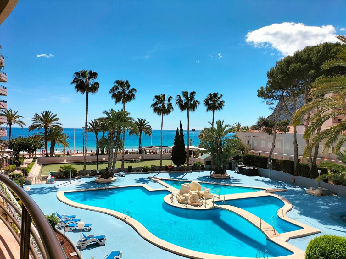 The estate's pool and the sea seen from the apartment's terrace