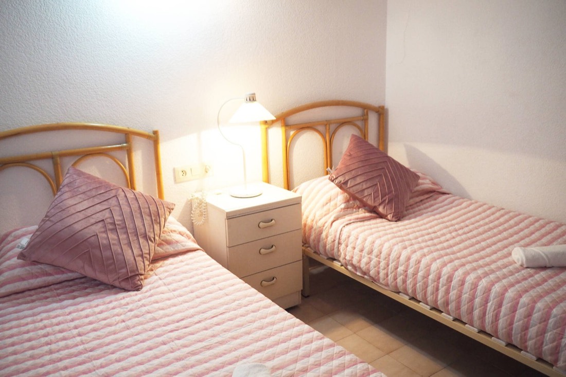 Second bedroom, also with two single beds