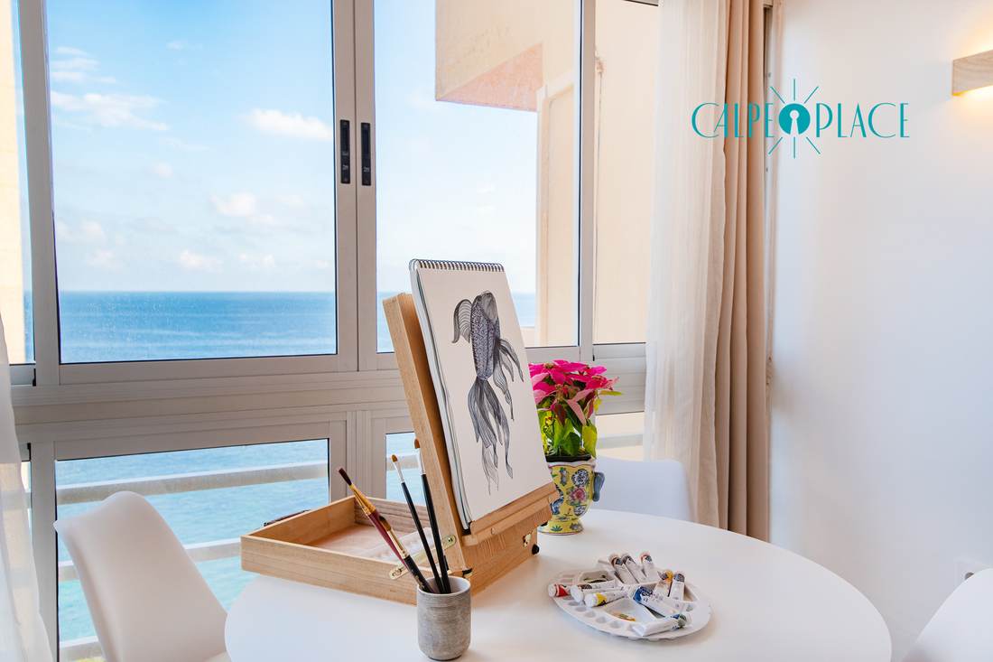 Table by the window with the sea at Calpe behind