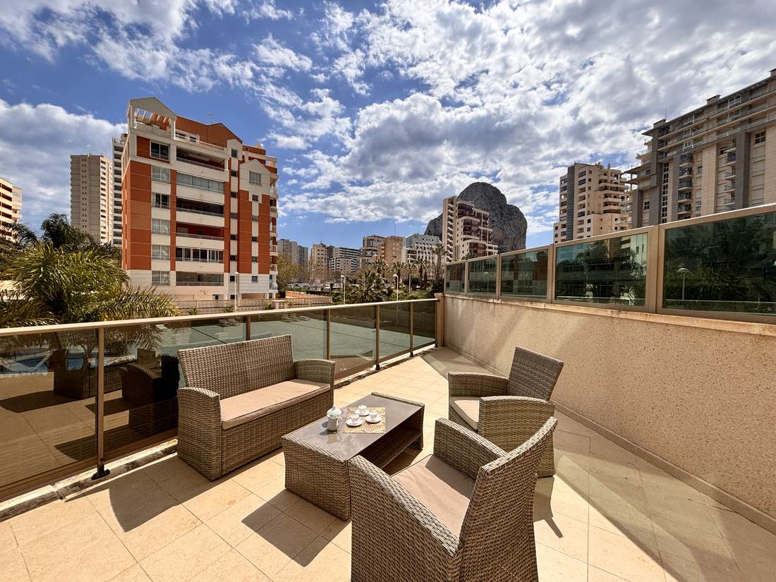 Terrace with rattan sofas and open views over the salt lake