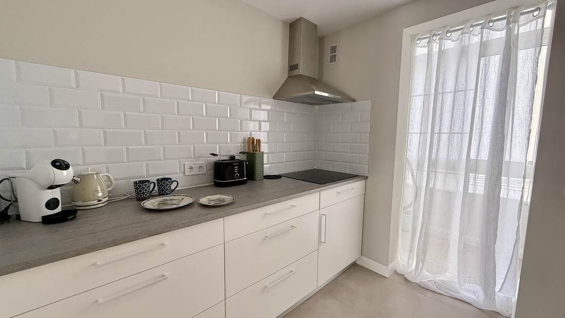 New kitchen with induction hob and extractor hood