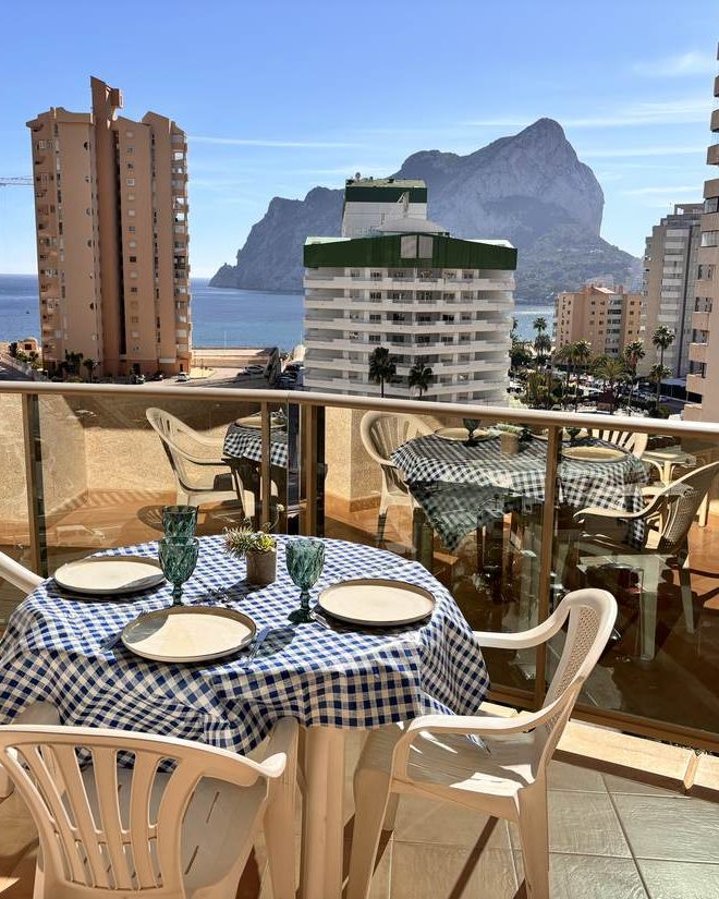 The terrace at Lima Esmeralda Suites with the table laid and the Peñón de Ifach behind