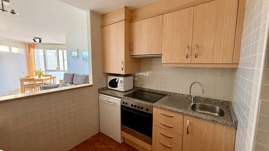Separate kitchen with ceramic hob, oven and washing machine