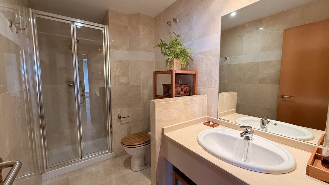 Refurbished bathroom with shower tray and glass screen