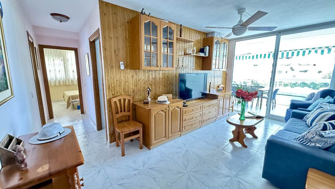 The living room from the gallery, with the wooden furniture