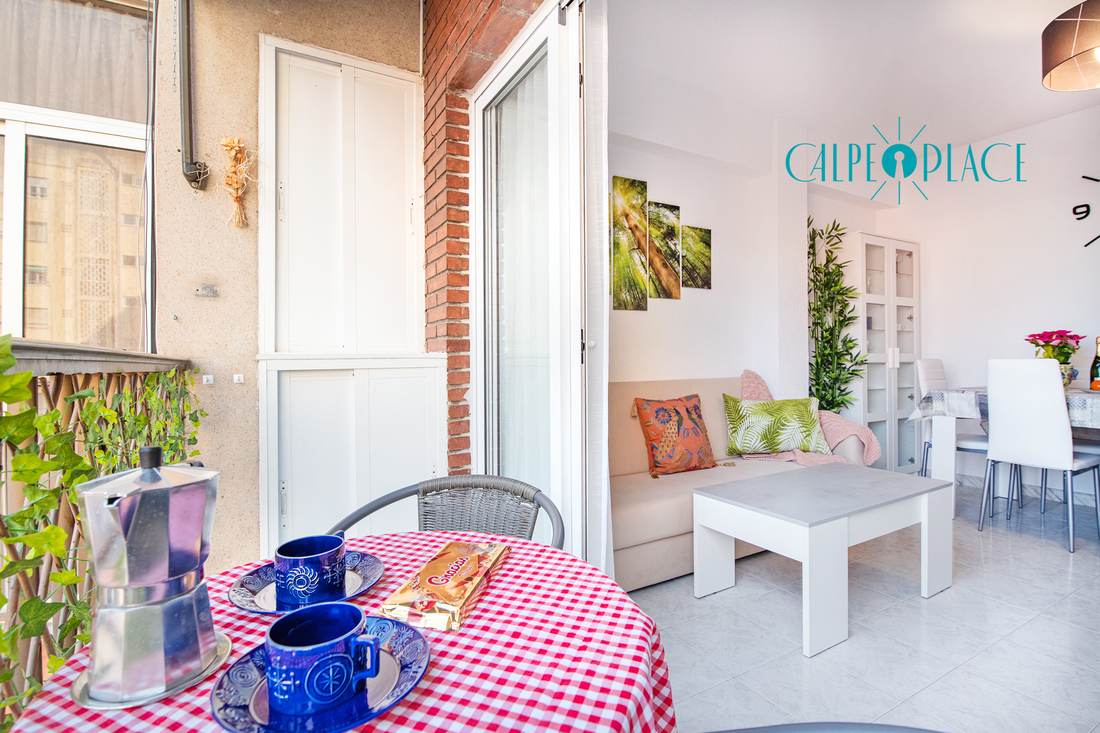Terrace with the table laid and a checked tablecloth