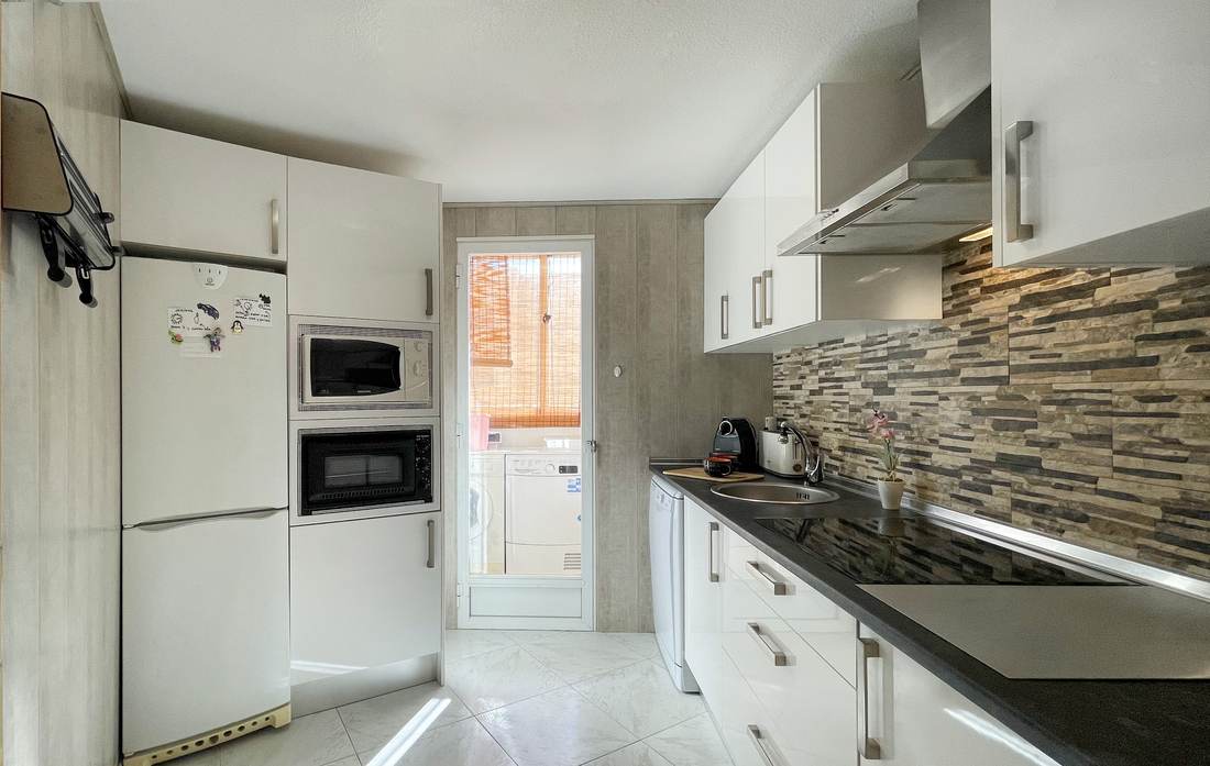 Separate kitchen with oven and microwave