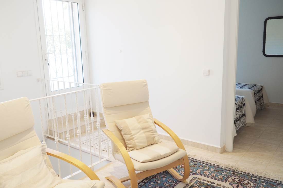 Galería con sillones — Villa Ricarlos
